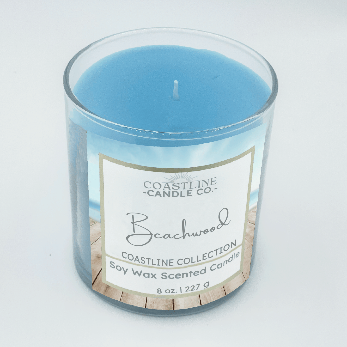 Beachwood Soy Wax Candle - Coastline Collection in 8 oz. in clear jar with blue wax