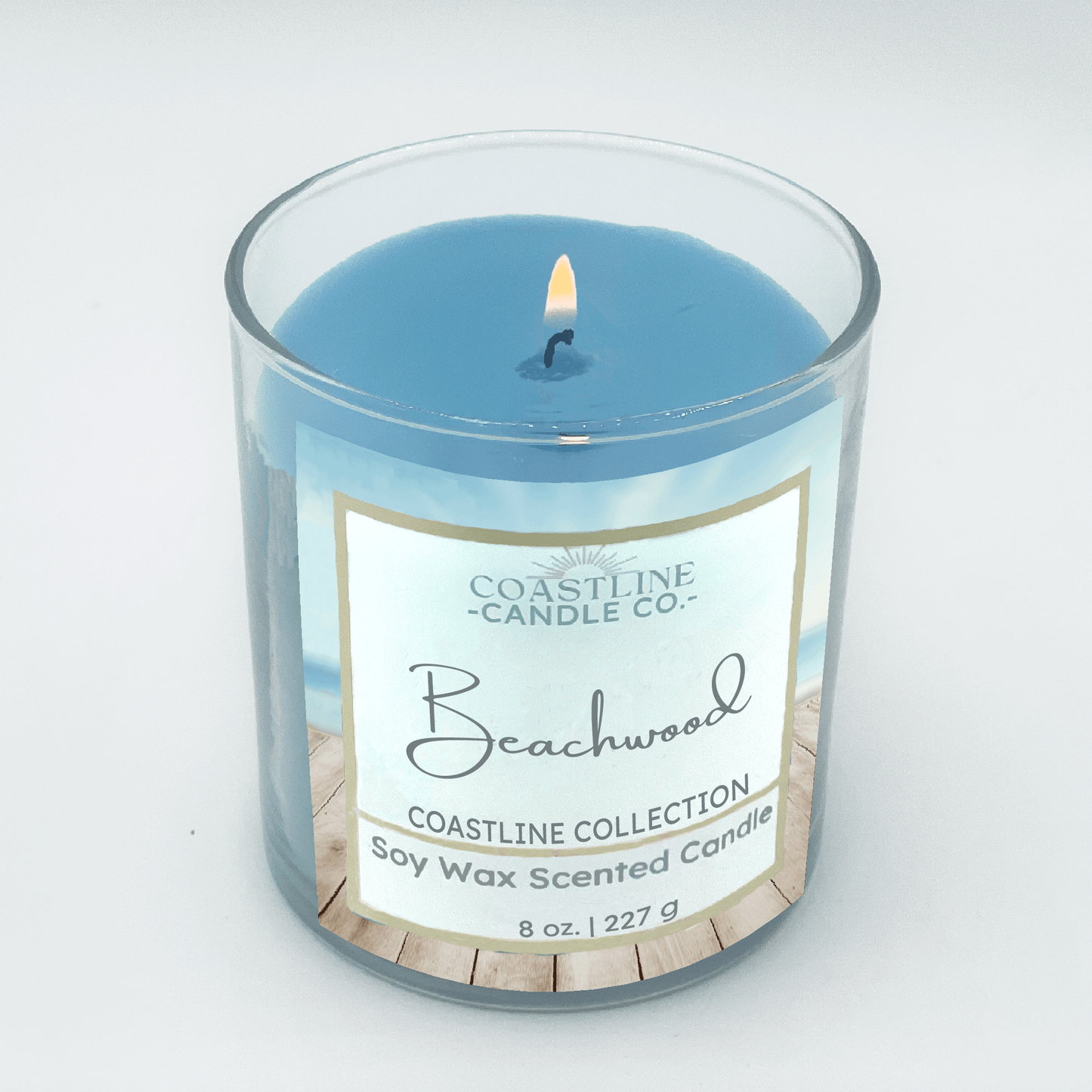 Beachwood Soy Wax Candle - Coastline Collection in 8 oz. in clear jar with blue wax