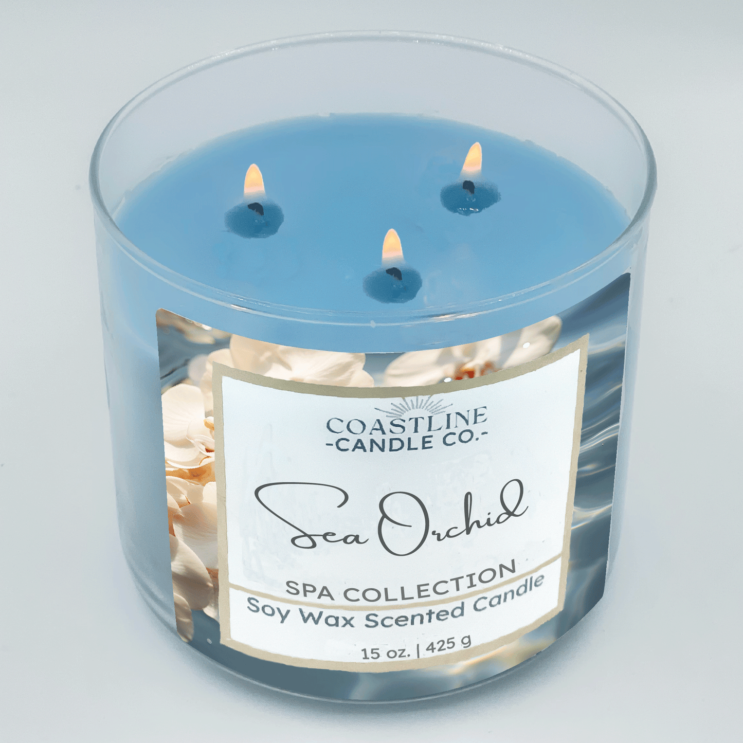 Sea Orchid Soy Wax Candle - Spa Collection in a 3 wick, 15 oz. clear jar with blue wax