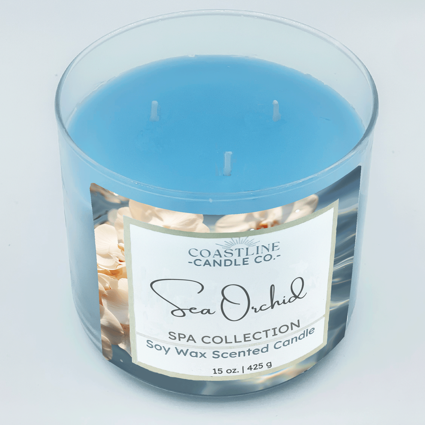 Sea Orchid Soy Wax Candle - Spa Collection in a 3 wick, 15 oz. clear jar with blue wax