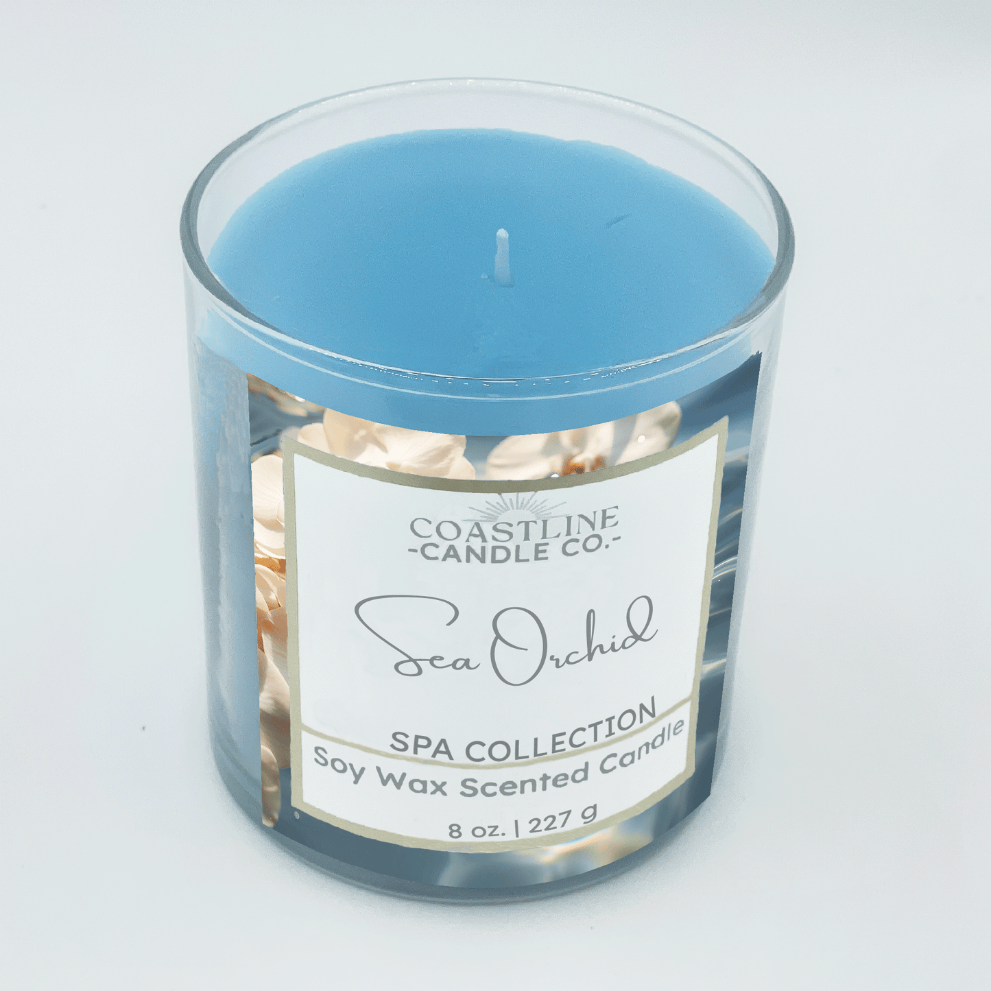 Sea Orchid Soy Wax Candle - Spa Collection in 8 oz. clear jar with blue wax